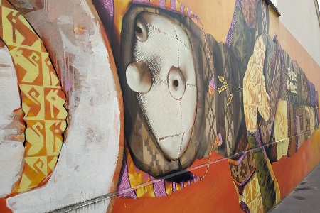 photo of the street art fresco in Paris 13 by INTI, entitled: An Innocent Doll